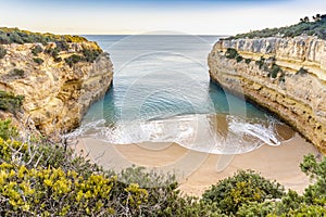 Beautiful Fontainhas Beach surrounded by yellow cliffs, Algarve, Portugal
