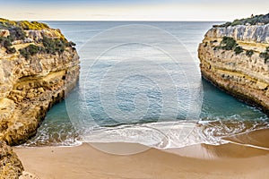 Beautiful Fontainhas Beach surrounded by yellow cliffs, Algarve, Portugal