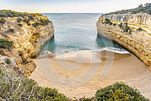 Beautiful Fontainhas Beach surrounded by yellow cliffs, Algarve, Portugal photo