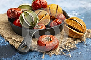 Beautiful food portrait of Wnter seasonal dried fruits with old vintage texture background and cutlery and accessories