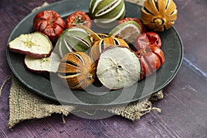 Beautiful food portrait of Wnter seasonal dried fruits with old vintage texture background and cutlery and accessories