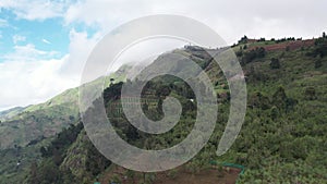 Beautiful forested mountain range with farmlands on hills, Kodaikanal, Tamil Nadu, India