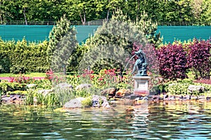 A beautiful fountain on the lake in the Mezhyhirya landscape park near Kiev.