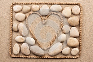 Beautiful frame of rope in the form of heart with white stones