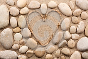 Beautiful frame of rope in the form of heart with white stones
