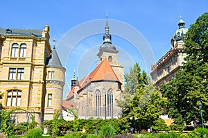 Beautiful Franciscan Monastery in Plzen, Czech Republic photographed from the park in Krizikovy sady. Medieval architecture,