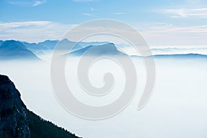 Beautiful french alps winter panoramic aerial view landscape with a fantastic blue haze cloudy mountain background