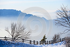 Beautiful french alps winter panoramic aerial view landscape with a fantastic blue haze cloudy mountain background