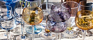 Beautiful French wine glasses in different colors, panoramic view