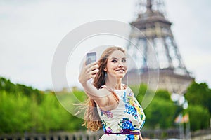 Beautiful French woman walking near the Eiffel tower