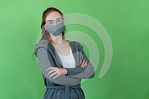 Beautiful french woman wearing face mask as protection against coronavirus infection
