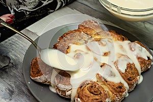 Beautiful fresh cinnamon rolls. The cooking process. Fresh fragrant pastries. Raw dough for buns.The process of making buns