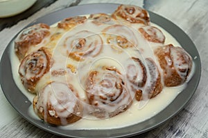 Beautiful fresh cinnamon rolls. The cooking process. Fresh fragrant pastries. Raw dough for buns.The process of making buns