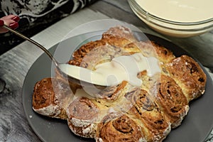Beautiful fresh cinnamon rolls. The cooking process. Fresh fragrant pastries. Raw dough for buns.The process of making buns