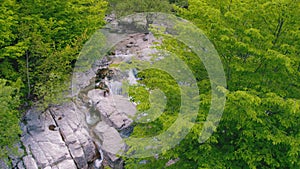 beautiful fresh green scenery with mini waterfall in deep