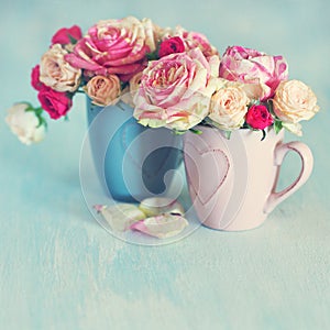 .Beautiful fresh pink roses on a table.