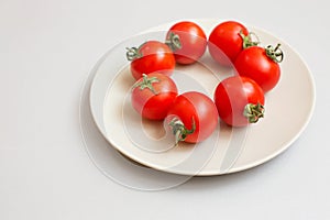 Beautiful fresh tomatoes on a plate
