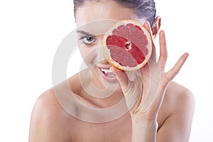 Beautiful fresh woman with grapefruit.