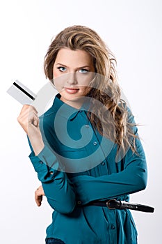 Beautiful friendly girl showing credit card in hand