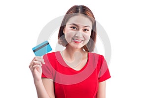 Beautiful friendly smiling asian girl showing credit card in han