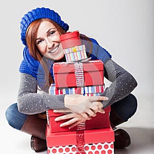 Beautiful friendly woman with Christmas gifts