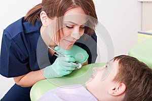 Beautiful and friendly woman dental hygienist photo