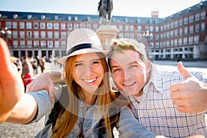 Beautiful friends tourist couple visiting Europe in holidays students exchange taking selfie picture