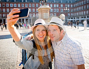 Beautiful friends tourist couple visiting Europe in holidays students exchange taking selfie picture