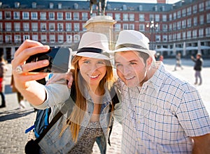 Beautiful friends tourist couple visiting Europe in holidays students exchange taking selfie picture