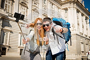 Beautiful friends tourist couple visiting Spain in holidays students exchange taking selfie picture