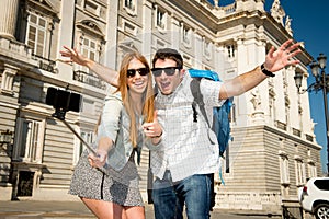 Beautiful friends tourist couple visiting Spain in holidays students exchange taking selfie picture