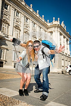 Beautiful friends tourist couple visiting Spain in holidays students exchange taking selfie picture