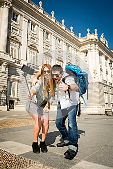 Beautiful friends tourist couple visiting Spain in holidays students exchange taking selfie picture