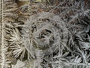 beautiful frosty patterns on the window glass