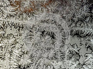 beautiful frosty patterns on the window glass