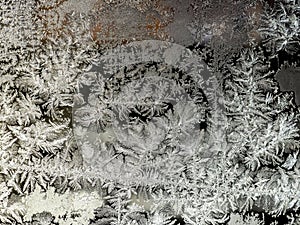 beautiful frosty patterns on the window glass