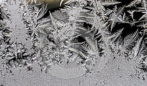 beautiful frosty patterns on the window glass