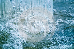 A beautiful frozen icicles at the bank of river in Latvia.