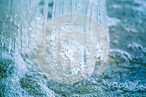 A beautiful frozen icicles at the bank of river in Latvia.