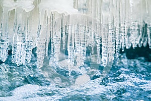 A beautiful frozen icicles at the bank of river in Latvia.