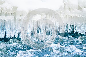 A beautiful frozen icicles at the bank of river in Latvia.