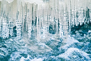 A beautiful frozen icicles at the bank of river in Latvia.