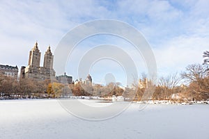 Beautiful Frozen Lake with Snow at Central Park in New York City during Winter with the Upper West Side Skyline