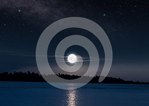 Beautiful full moon and moonlight reflection in tropical sea