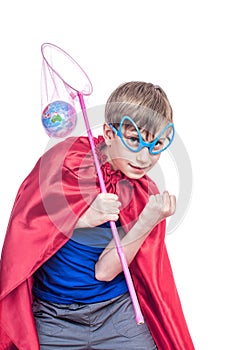 Beautiful funny child dressed as superman saving the Earth