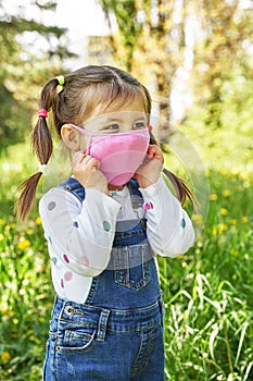 Beautiful funny girl in a medical mask