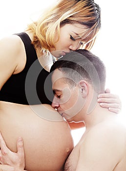Beautiful future parents: his pregnant asian wife and a happy husband acting kiss together