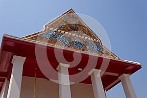 ?Beautiful gable of the church is decorated with stucco and ceramic designs in the temple ?Bangkok