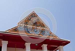 ?Beautiful gable of the church is decorated with stucco and ceramic designs in the temple ?Bangkok