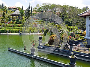 Beautiful garden and lake at Ujung water temple Bali Indonesia photo